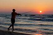Man fishing on Lake Michigan, USA
