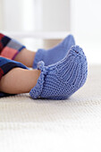 Boy wearing knitted slippers