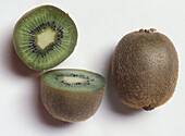 Whole kiwi fruit and cut half