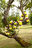 Flower garlands draped in tree