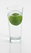Lime floating in glass of water