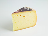 Slice of Swiss Mutschli cow's milk cheese