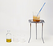 Soap in glass beaker on laboratory tripod