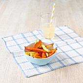 Root vegetable chips and glass of lemonade
