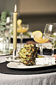 Festively laid table decorated with artichokes