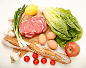 Bread, meat and eggs with vegetables and fruit