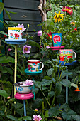Several colourful cup and saucer bird stations