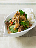 Thai beef curry with rice in bowl