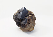 Blue gahnite octahedral crystal in rock groundmass