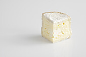 Slice of French chaource AOC cow's milk cheese