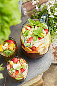 Jugs of Pimm's with strawberries, lemon and mint