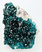 Blue-green dioptase crystals in groundmass, close-up