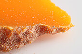 Slice of French Mimolette cow's milk cheese