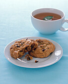 Two chocolate chip cookies and cup of herbal tea