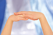 Woman massaging hands