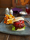 Beef burger served with veggie chips