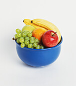 Blue bowl containing fresh fruit