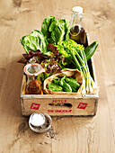 Crate of lettuce and salad-making ingredients