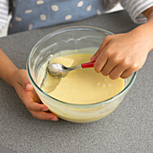 Boy making chocolate truffles