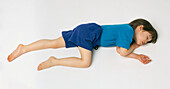 Girl lying in recovery position