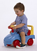 Child on toy car