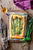 Asparagus puff pastry pie with mozzarella