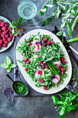 Green peas raspberry salad with herb oil