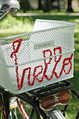 Bicycle basket with embroidered with the word 'hello