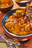 Lamb and orange couscous with carrots and onions
