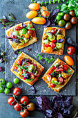 Tomato puff pastries with cheese and marinated tomatoes