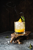 Orange cocktail with rosemary