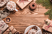 Christmas decorated background with hot chocolate and wrapped presents