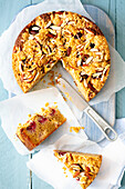 Almond cake with peaches and raspberries