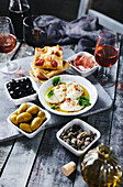 Italian appetizers – focaccia, burrata, olives, salted capers