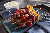Grilled beef, bell pepper and red onion skewers