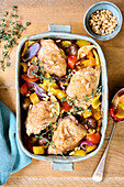 Chicken casserole with peppers, chestnuts and pine nuts