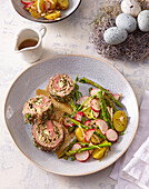 Lamb roll with almond filling and radish asparagus salad