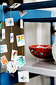 DIY garland of stamps on a blue shelf