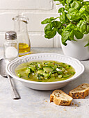 Green spring soup with herb pesto