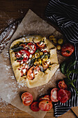Mixed tomato Galette, topped with fresh sage herb leaves and Feta cheese