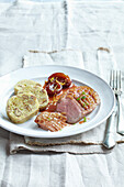 Duck breast with plum sauce and nut and potato dumplings