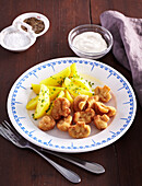 Fried mushrooms with chive potatoes and tatar sauce