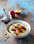 Millet pudding with poppy seeds and plums