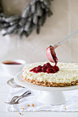 Rice pudding cake with red fruit jelly for Christmas