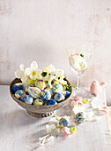 Blue and white marbled chocolate eggs with liqueur