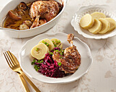 Duck legs with red cabbage and dumplings
