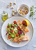 Baked salmon with herbs and vegetable salad