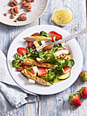 Salad with grilled chicken, strawberries and lamb‘s lettuce