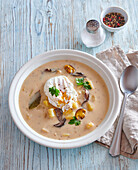 Creamy mushroom soup with poched egg