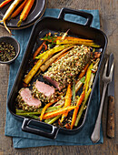 Pork tenderloin in herb crust with carrot and celery French fries